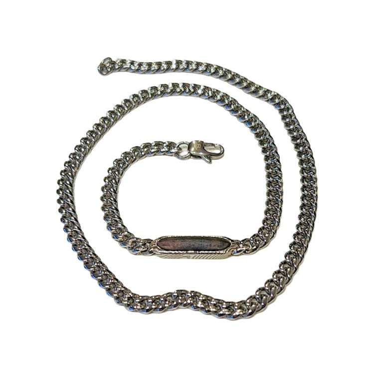 Stainless steel necklace by T.M.J featuring Damascus steel and ebony wood inlay, showcasing a sleek chain design.