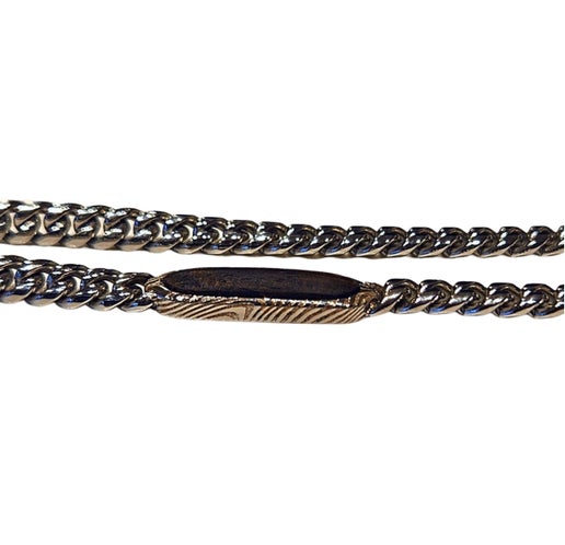 Stainless steel necklace by T.M.J featuring Damascus steel and ebony wood inlay, showcasing a sleek and elegant chain design.