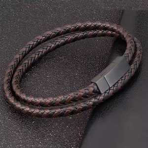 Men’s leather bracelet by T.M.J with black and brown woven pattern, 19cm, stylish men's leather bracelet accessory.