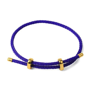 Genuine 4mm braided stainless steel leather bracelet with gold-tone accents by T.M.J, featuring a stylish and durable design.