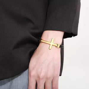 T.M.J flat braided leather bracelet with large gold cross, stylish men's accessory featuring textured leather and bold design.