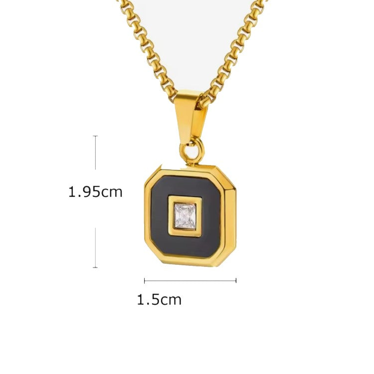 Aurex Onyx and princess-cut CZ pendant by T.M.J, stainless steel with PVD plating, showcasing a sleek, elegant jewelry design.
