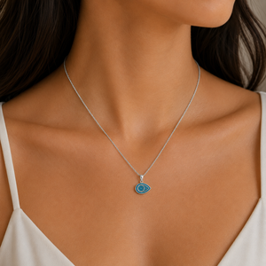 Sterling silver Azure Guardian Evil Eye Pendant by T.M.J, featuring a detailed evil eye design on a sleek pendant.