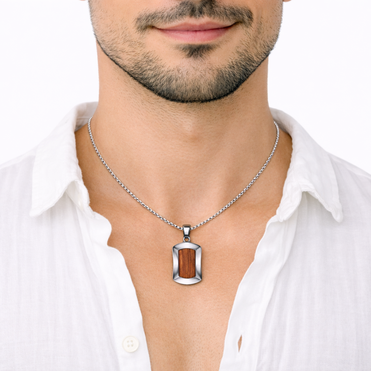 Men’s stainless steel pendant with Bubinga wood inlay, featuring a sleek design and polished finish, by T.M.J.