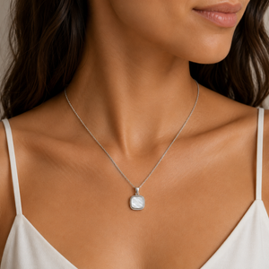 Sterling silver moon shell pendant with mother of pearl inlay, showcasing a delicate, natural design by T.M.J for pendants.