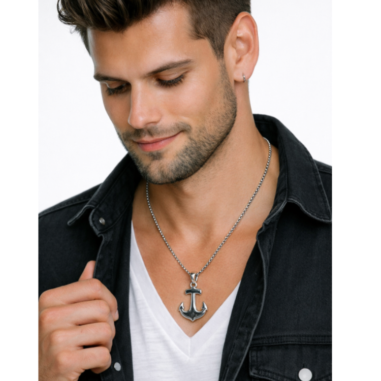 Stainless steel Gibeon meteorite anchor pendant with chain, featuring a textured meteorite surface and polished metal details.