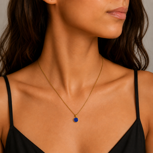 Sterling silver, gold, and lapis lazuli pendant from T.M.J featuring elegant craftsmanship and vibrant blue stone details.