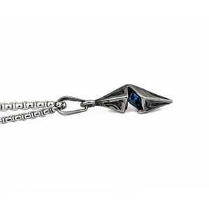 Vesper steel spike pendant by T.M.J with antique finish and blue CZ accent, showcasing a bold, edgy jewelry design.