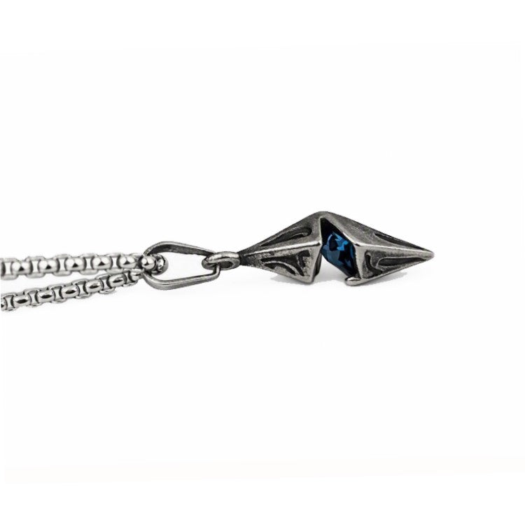 Vesper steel spike pendant by T.M.J with antique finish and blue CZ accent, showcasing a bold, edgy jewelry design.