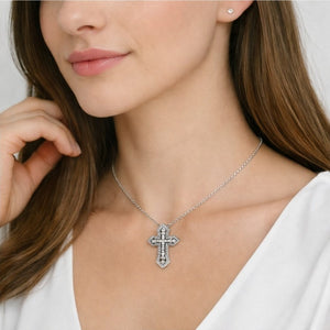 Sterling silver Duetta Dual Cross Pendant Necklace by T.M.J, featuring two overlapping religious cross charms.