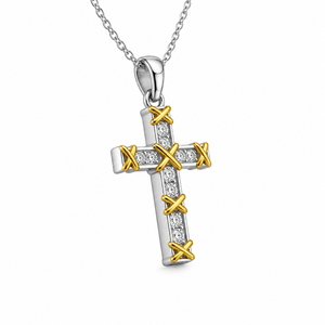 Sterling silver and gold-plated cross pendant with cubic zirconia from T.M.J, featuring a detailed religious design.