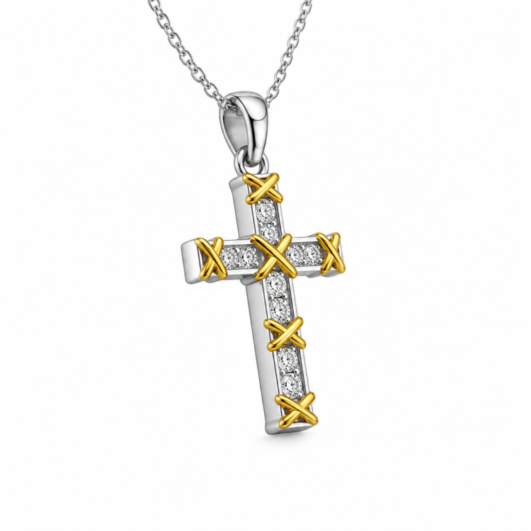 Sterling silver and gold-plated cross pendant with cubic zirconia from T.M.J, featuring a detailed religious design.
