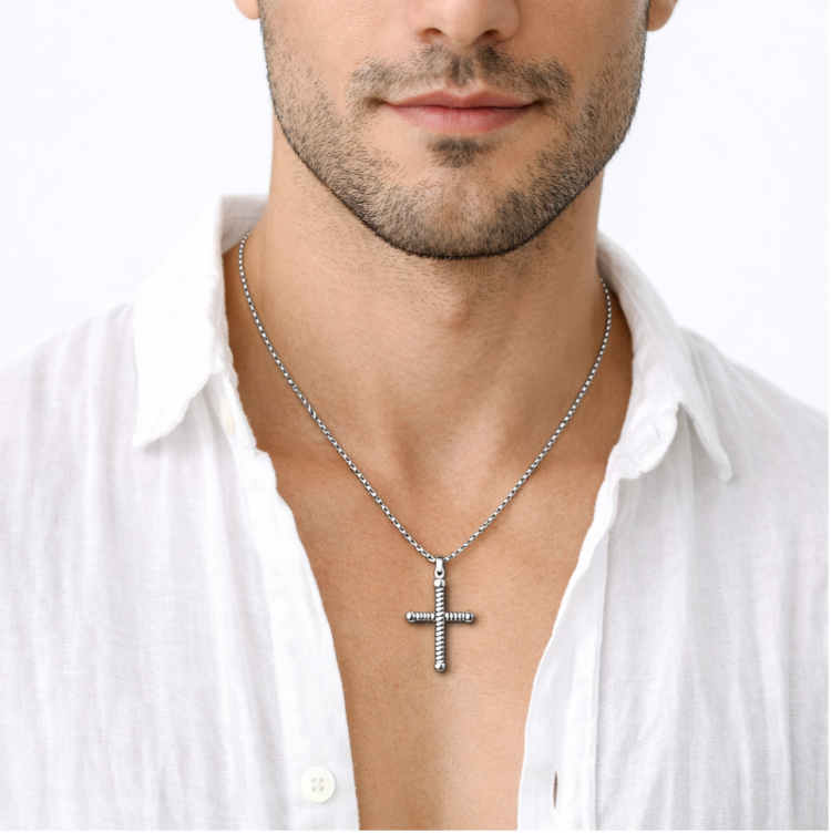 Sterling silver men's twisted cross pendant with religious design, crafted by T.M.J. featuring intricate twisted cross details.