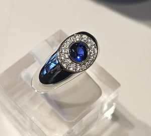 Sterling silver Blue Sapphire ring from T.M.J Apex Series, featuring a polished band and a vibrant blue sapphire gemstone.