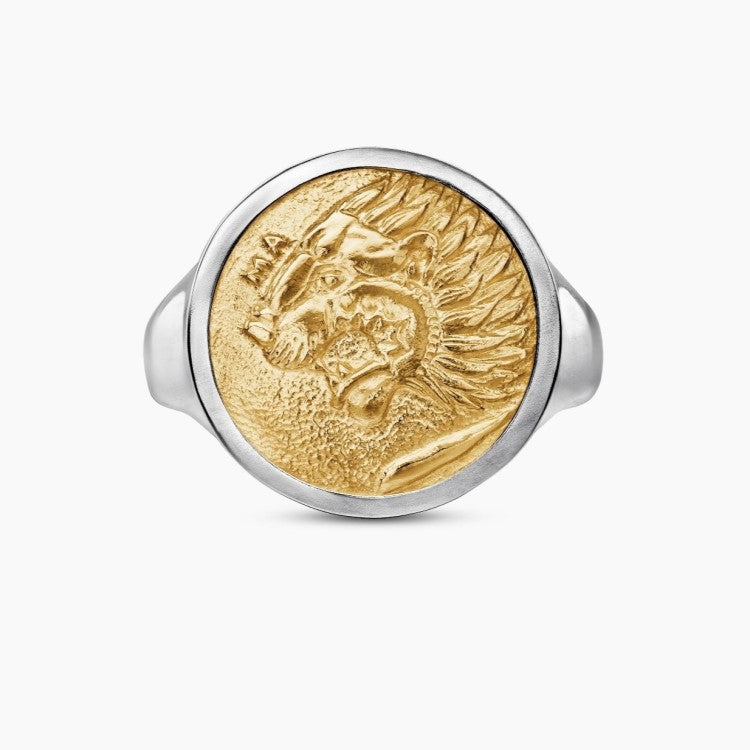 Sterling silver Nemean Lion signet ring with 18k gold accent, crafted by T.M.J, showcasing intricate lion design on the ring face.