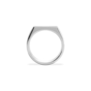 Sterling silver rhodium-polished signet ring with 4mm by 16mm face from T.M.J, showcasing a sleek, shiny design.