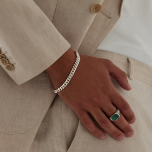 Vanguard men's sterling silver ring with a vibrant green malachite gemstone, crafted by T.M.J in a sleek silver design.