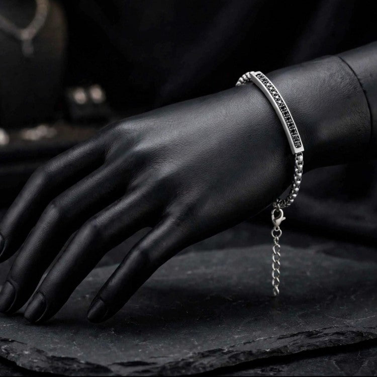 Cassiopeia steel bar bracelet by T.M.J with black CZ stones, stainless steel jewelry featuring sleek design and sparkling accents.
