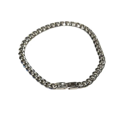 Stainless steel and gold-plated curb link bracelet by T.M.J, 5mm wide, with a polished finish on a white background.