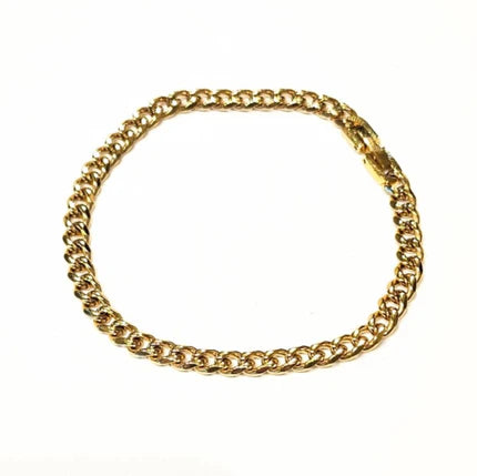 Stainless steel and gold-plated curb link bracelet by T.M.J, 5mm width, 19.5cm length, featuring sleek metallic links.