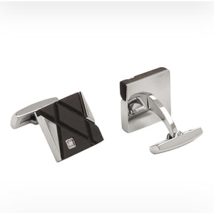Elegant stainless steel and carbon fiber cufflinks with cubic zirconium accents, featuring a sleek, modern design by T.M.J.