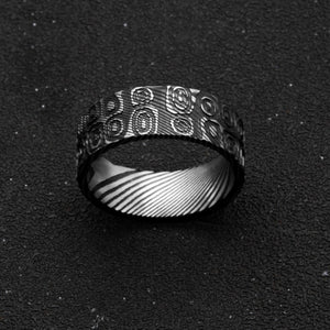 T.M.J men's stainless steel Aegis Damascus ring with ovals and circles, symbolizing cycles, protection, and unity.