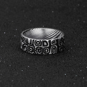 T.M.J stainless steel men's Aegis ring featuring Damascus ovals and circles symbolizing cycles, protection, and unity.