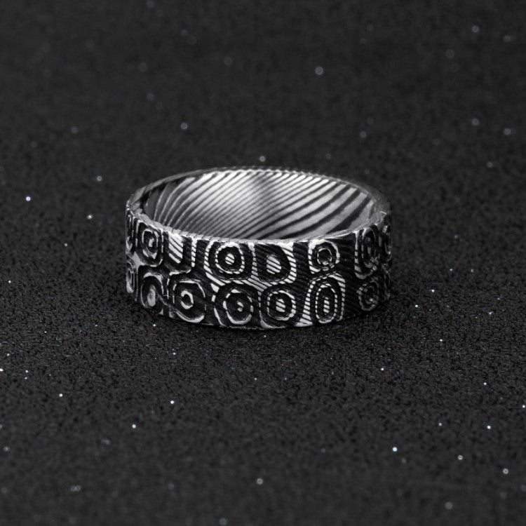 T.M.J stainless steel men's Aegis ring featuring Damascus ovals and circles symbolizing cycles, protection, and unity.