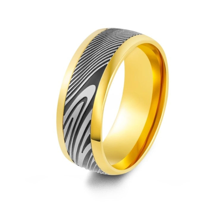 8mm etched Damascus steel and stainless steel ring by T.M.J, featuring intricate patterns on a sleek silver band.
