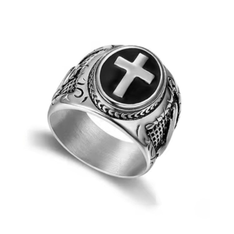 Men’s vintage oval cross signet ring by T.M.J, stainless steel with enamel base, featuring a classic engraved cross design.