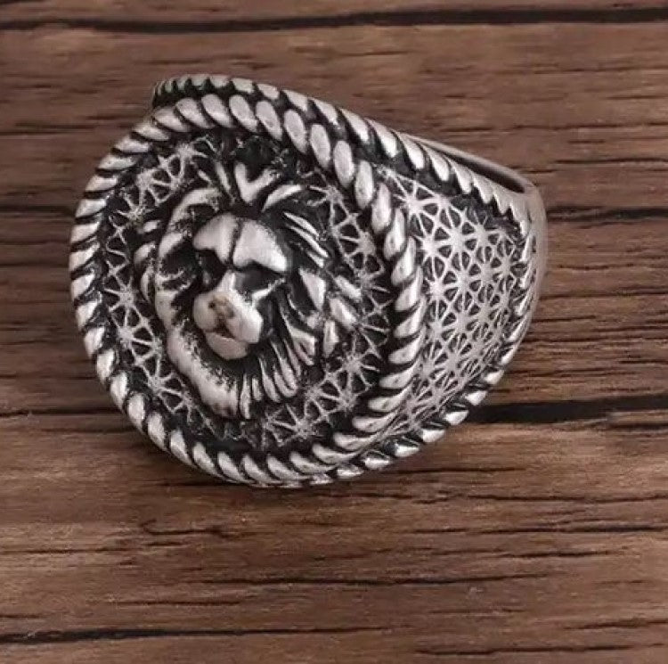 Silver men's stainless steel ring with an antique lion head emblem, symbolizing strength and legacy, from T.M.J.