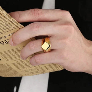 Stainless steel men's square face ring by T.M.J in polished silver or gold with a modern, bold silhouette.