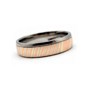 T.M.J The Tsuchi Band 6mm Damascus stainless steel ring, showcasing intricate layered steel detail.