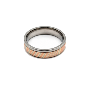 T.M.J The Tsuchi Band 6mm Damascus stainless steel ring, showcasing intricate metalwork and sleek design.