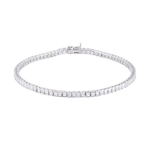 Sterling silver princess cut CZ tennis bracelet by T.M.J featuring a sleek, elegant design with sparkling cubic zirconia stones.
