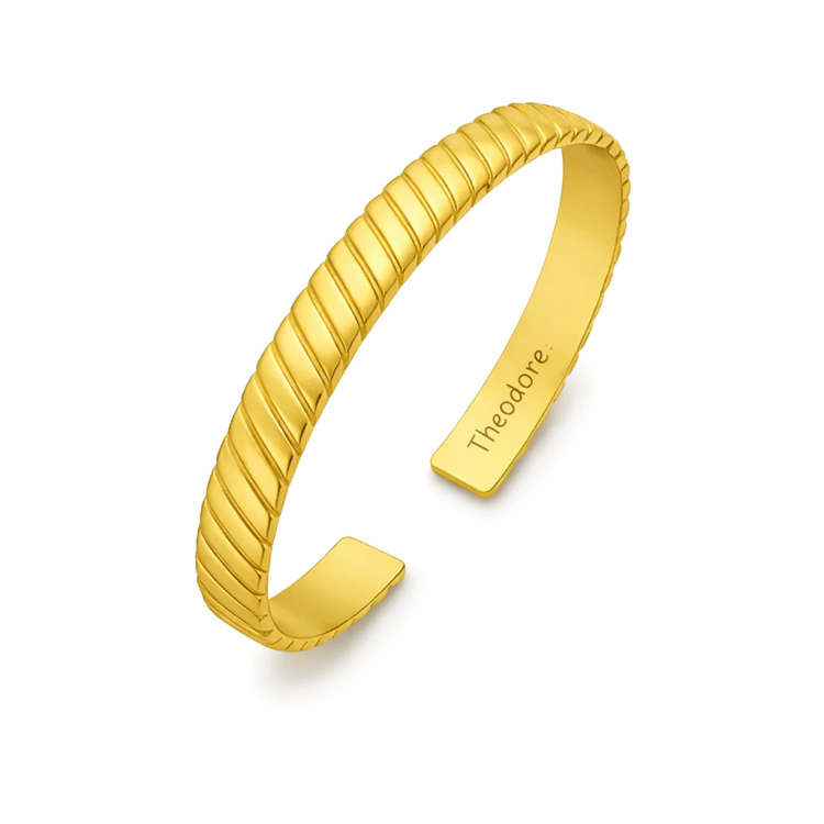 Sterling silver bangle with gold-plated or brushed rhodium Chevron design, by T.M.J, showcasing elegant jewelry craftsmanship.