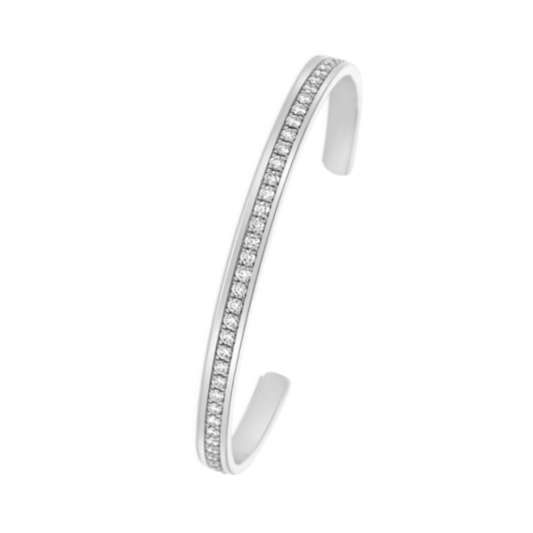 Sterling silver cuff bangle with white sapphires from T.M.J, featuring a sleek, polished bracelet design with sparkling gemstone accents.
