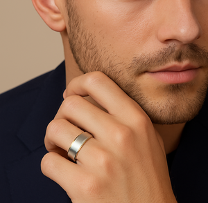 Titanium ring with gold edge and satin finish top, stylish T.M.J jewelry design, close-up view of the elegant men's ring