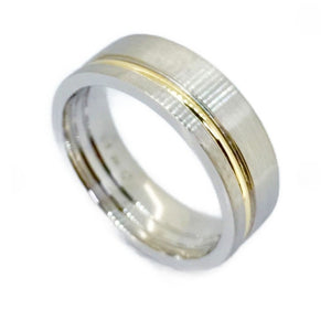 Titanium satin finish ring with gold inlay, 7mm wide, by T.M.J, showcasing elegant two-tone jewelry design