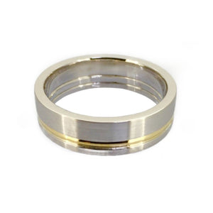 Titanium satin finish ring with gold inlay, 7mm wide, from T.M.J, showcasing sleek modern design and smooth surface.