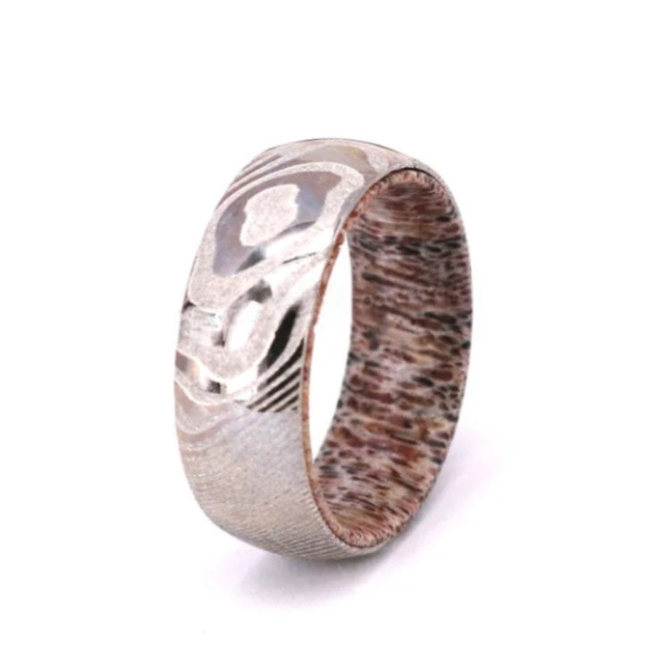 Titanium ring by T.M.J with Damascus steel and deer antler insert, comfort fit, polished finish, top view.