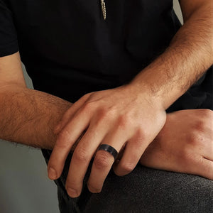 T.M.J Tungsten Rings "The Abyss" tungsten carbide ring with a sleek, polished finish and subtle dark accents for modern style.