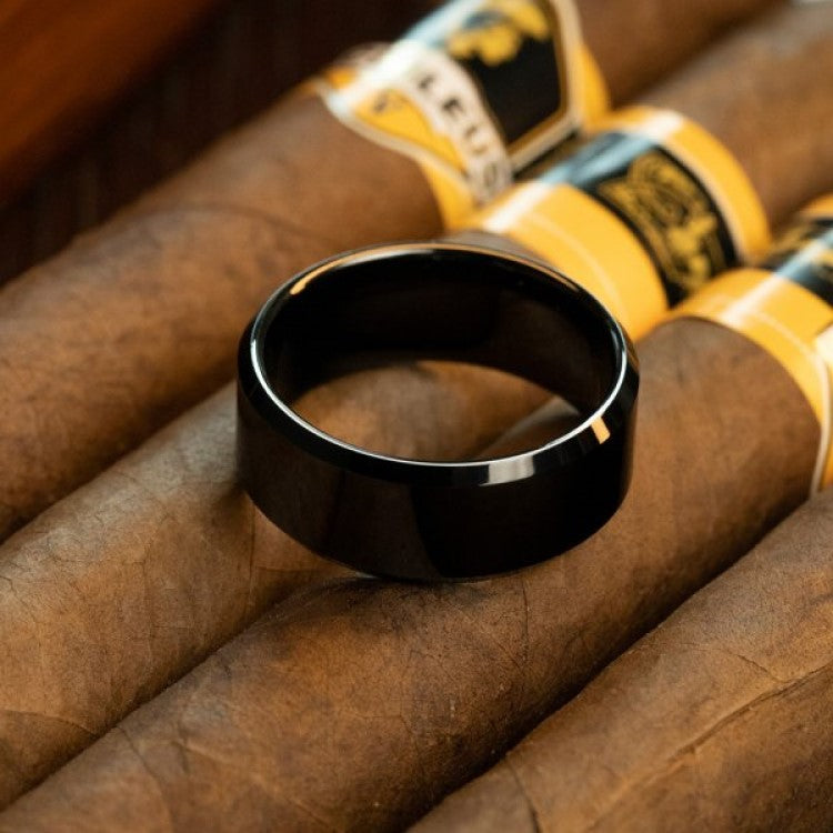 T.M.J Tungsten Carbide Ring called The Abyss, with a sleek, dark finish and polished edges, designed for men's jewelry.