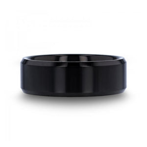 T.M.J The Abyss tungsten carbide ring featuring a sleek, dark finish and smooth band design for men's tungsten rings.