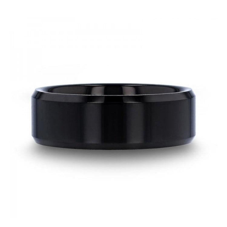 T.M.J The Abyss tungsten carbide ring featuring a sleek, dark finish and smooth band design for men's tungsten rings.