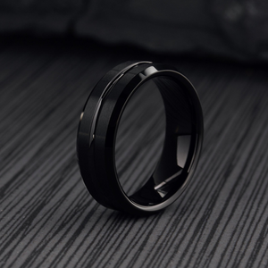 T.M.J Black Ember Tungsten Carbide Ring showing a sleek, dark finish and smooth band design for men's tungsten rings.