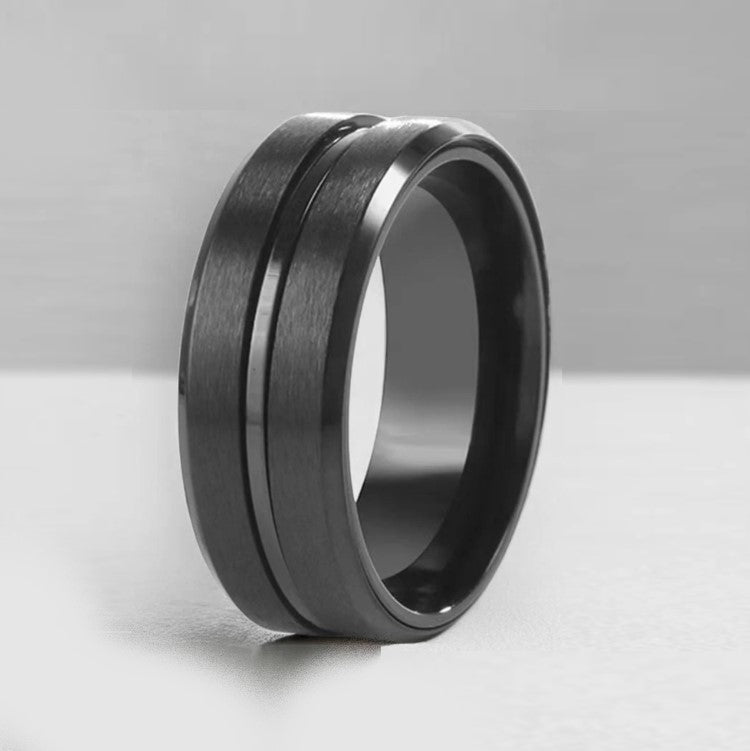 Black zirconium patterned men's ring from T.M.J, showcasing a sleek design with intricate details in zirconium material.