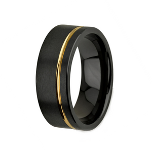 Black and gold zirconium ring called The Rebal with sleek design, featuring zirconium material and T.M.J branding.