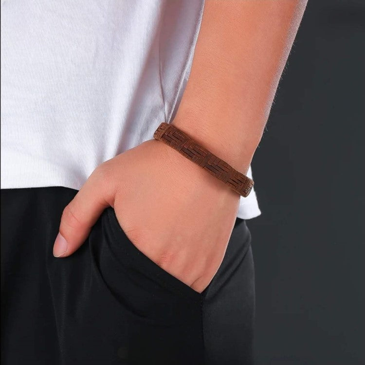 Brown leather bracelet with a braided design and stainless steel clasp, crafted by TMJ.