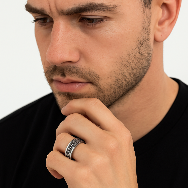 Stainless steel men's silver braided ring with a central design, crafted by TMJ, showcasing a polished, durable band.